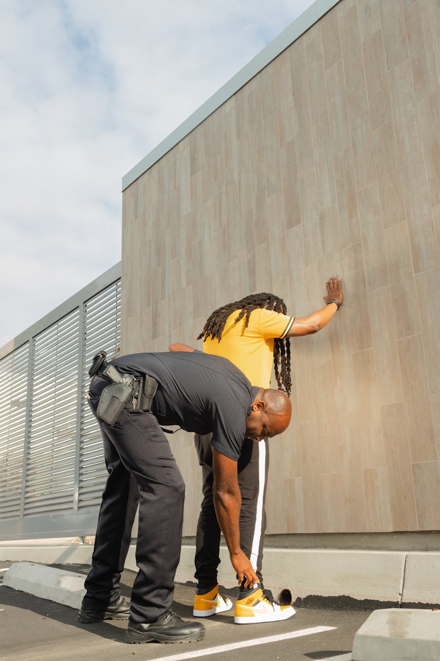 a police arresting a man