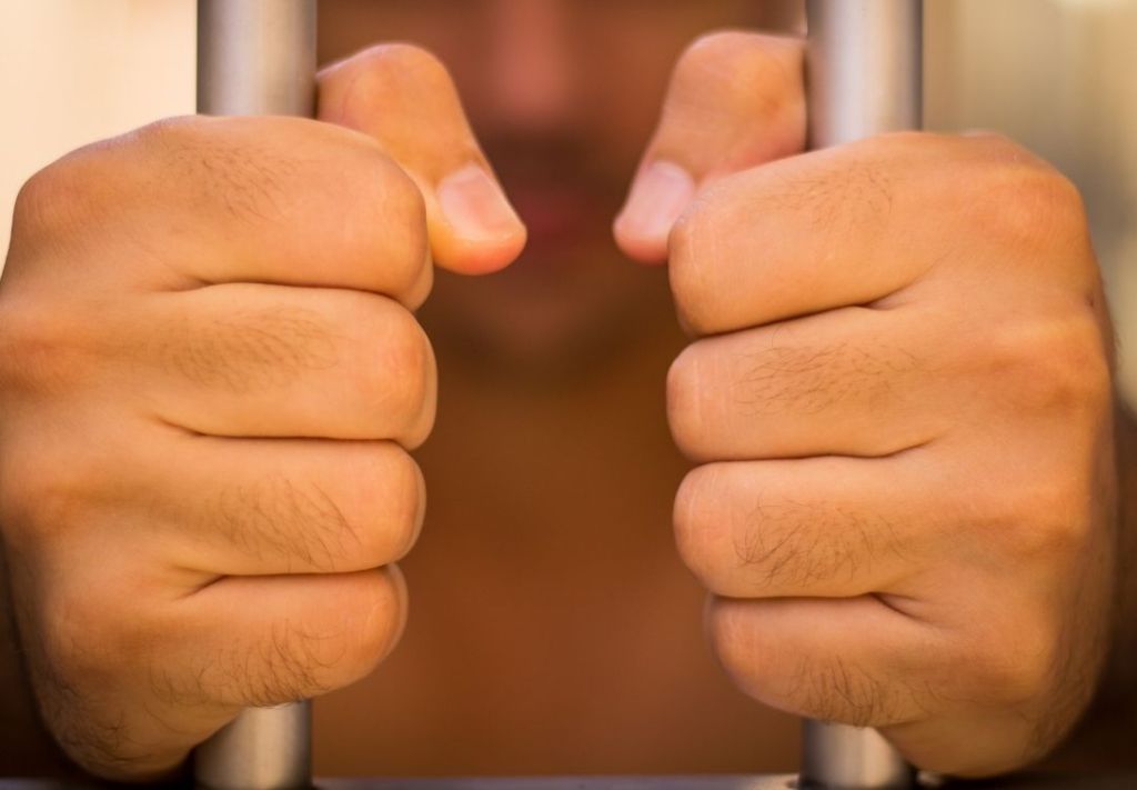 Clenched fists of a person, conveying anger or frustration.